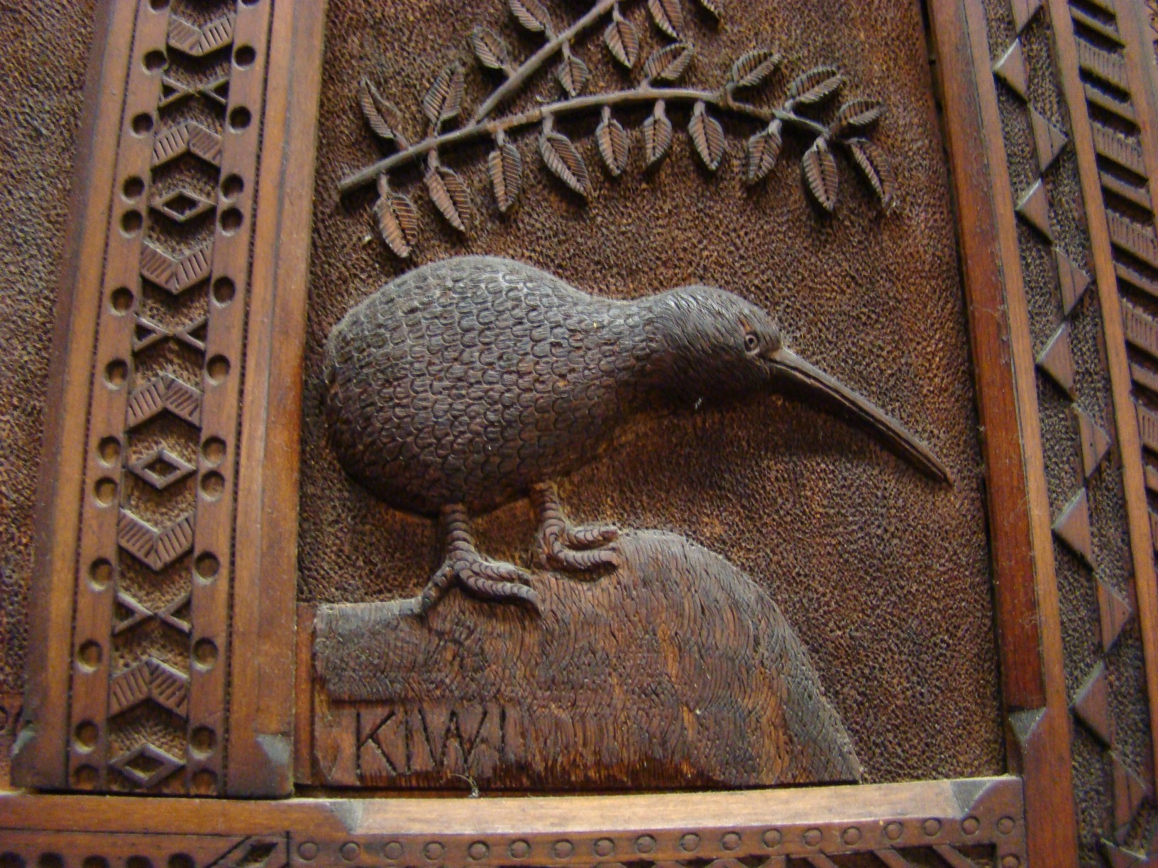 Kiwi: carved panel of native birds